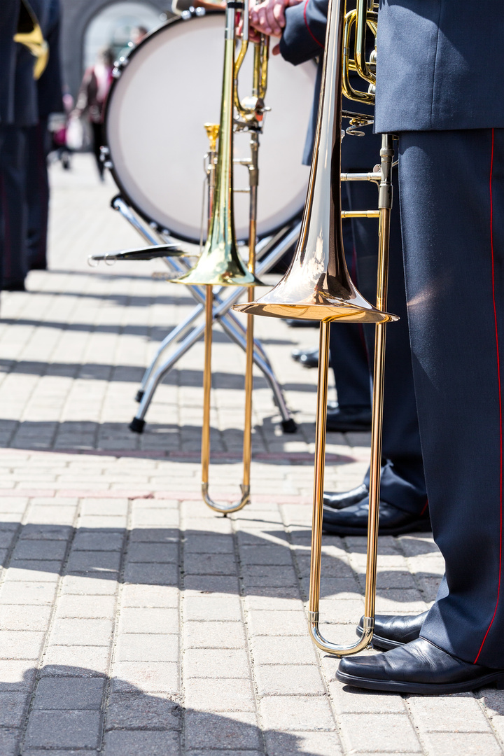 military brass band musicians with trombones